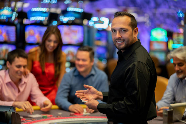 Professional Medusa II dealer team in branded attire at live blackjack table
